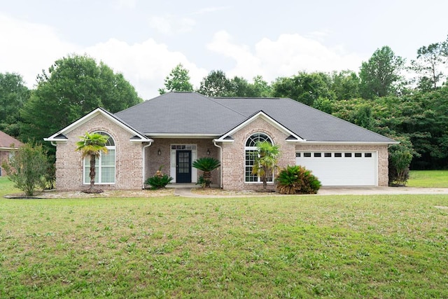144 Lee Road 2083, Phenix City, AL 36870 - single story home featuring a front yard, brick siding, concrete driveway, and an attached garage