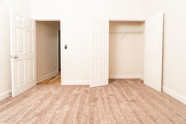 144 Lee Road 2083, Phenix City, AL 36870 - unfurnished bedroom with carpet, baseboards, and a closet