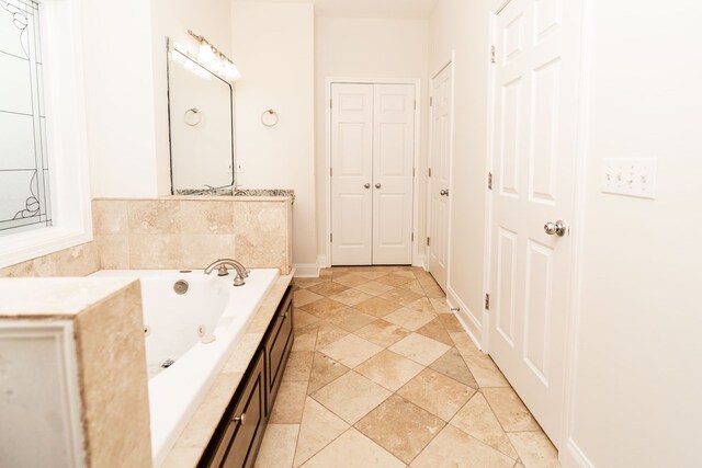 144 Lee Road 2083, Phenix City, AL 36870 - full bath with a tub with jets and stone finish floors