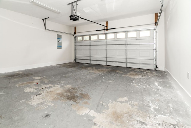 144 Lee Road 2083, Phenix City, AL 36870 - garage featuring a garage door opener, electric panel, and baseboards