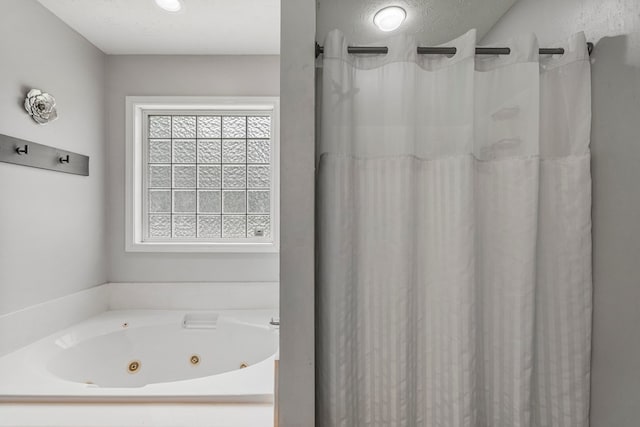 176 Lee Road 0504, Phenix City, AL 36870 - bathroom featuring a tub with jets and a shower with curtain