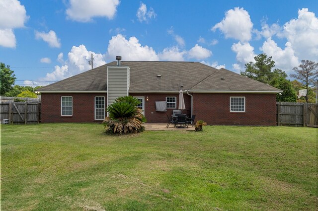 176 Lee Road 0504, Phenix City, AL 36870 - rear view of house with brick siding, a patio, a fenced backyard, and roof with shingles