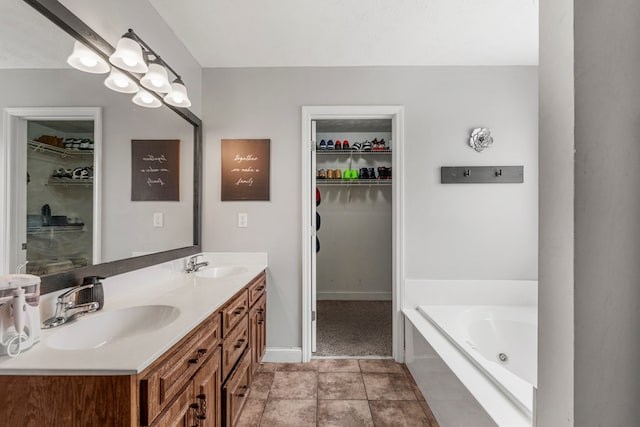 176 Lee Road 0504, Phenix City, AL 36870 - bathroom with double vanity, a tub with jets, and a walk in closet