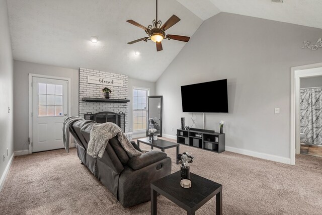 176 Lee Road 0504, Phenix City, AL 36870 - carpeted living room featuring a brick fireplace, a ceiling fan, and high vaulted ceiling