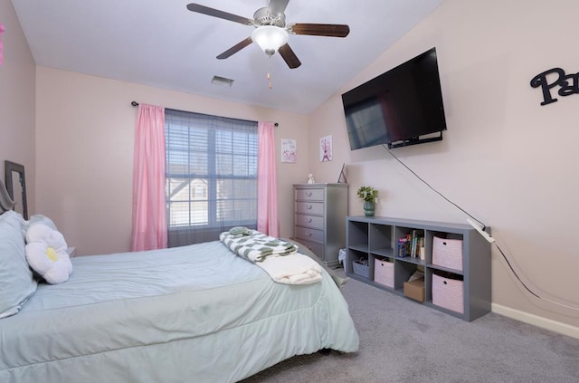 bedroom with lofted ceiling, ceiling fan, and carpet