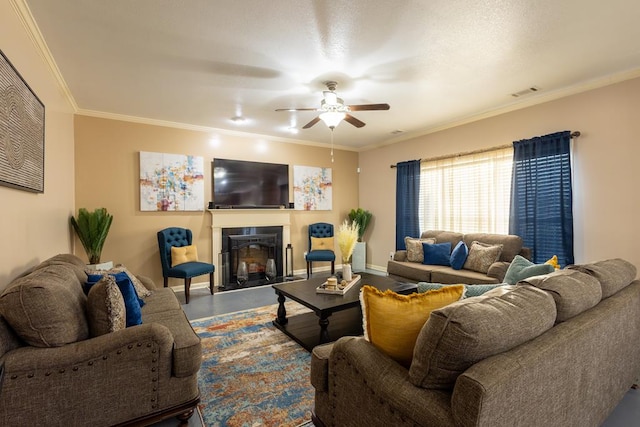 living room featuring ornamental molding and ceiling fan