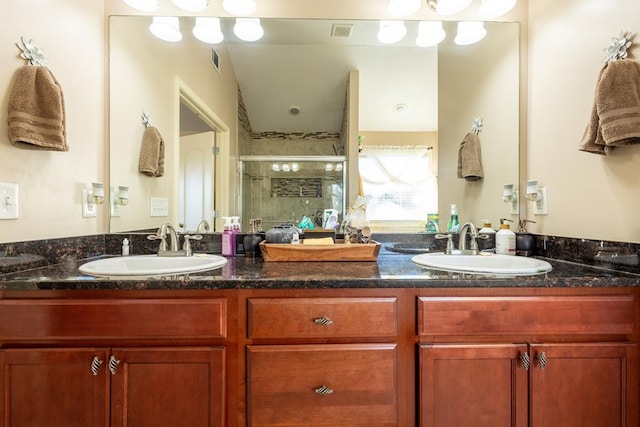 bathroom with an enclosed shower and vanity