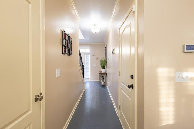 hallway featuring ornamental molding and dark hardwood / wood-style flooring