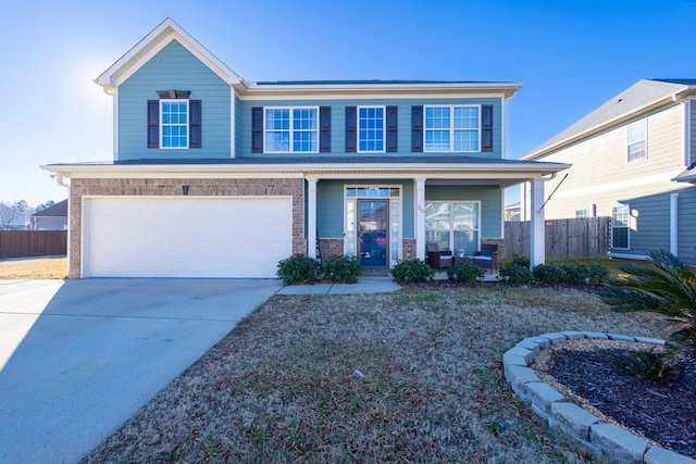 view of front of house featuring a garage and covered porch