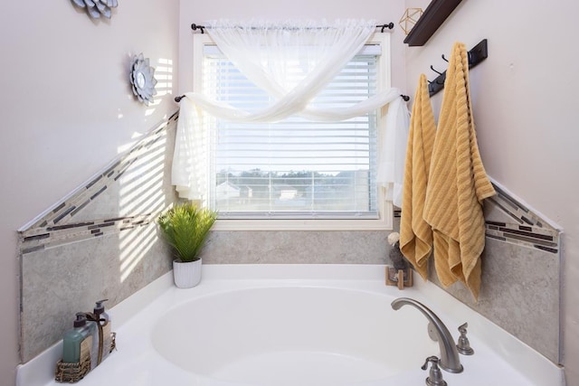 bathroom featuring a washtub