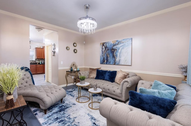 living room with a notable chandelier and crown molding