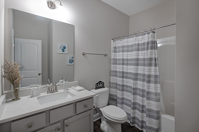 full bathroom featuring vanity, toilet, and shower / tub combo with curtain