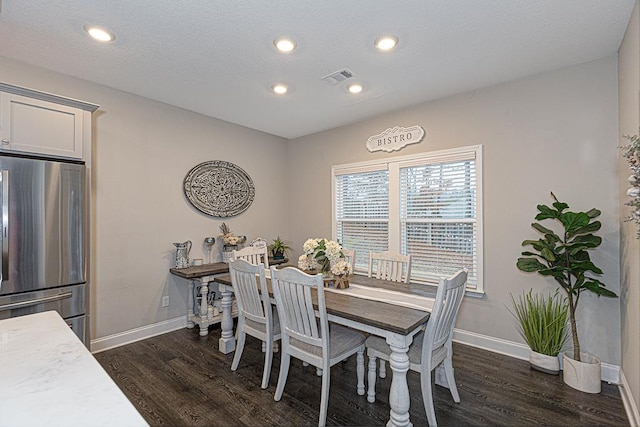 dining area with dark hardwood / wood-style floors