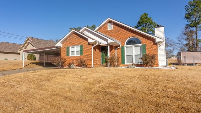 view of front of house featuring a front lawn and a carport