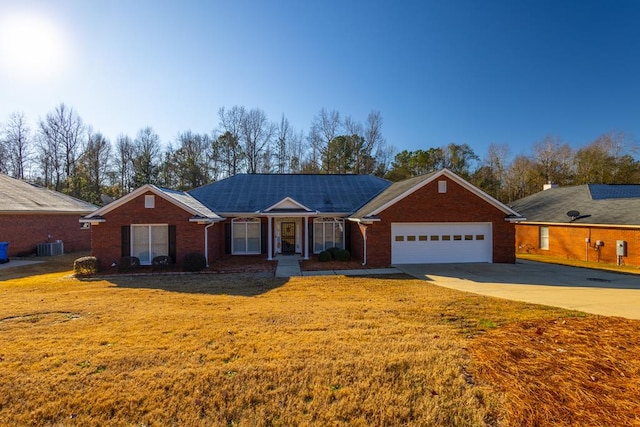 ranch-style home with a front lawn and a garage