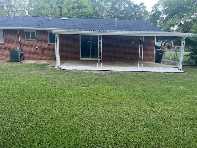 4229 Empire St, Columbus, GA 31907 - back of property featuring a patio, brick siding, a shingled roof, and a gate