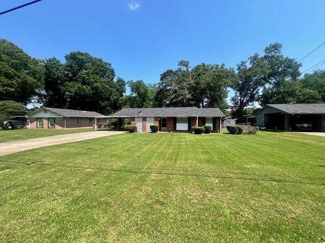 4229 Empire St, Columbus, GA 31907 - ranch-style house featuring driveway, a carport, and a front yard