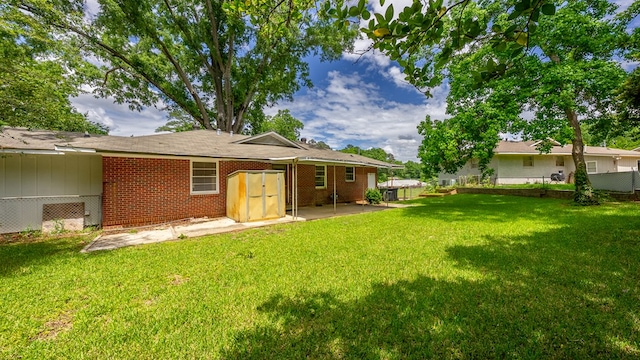 back of house featuring a patio and brick siding