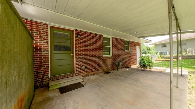 view of patio / terrace with an attached carport