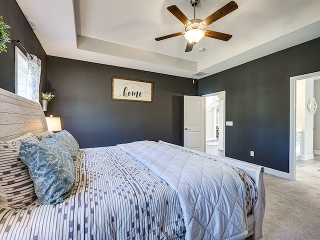 13733 Macon Rd, Upatoi, GA 31829 - bedroom featuring a raised ceiling, light colored carpet, and ceiling fan
