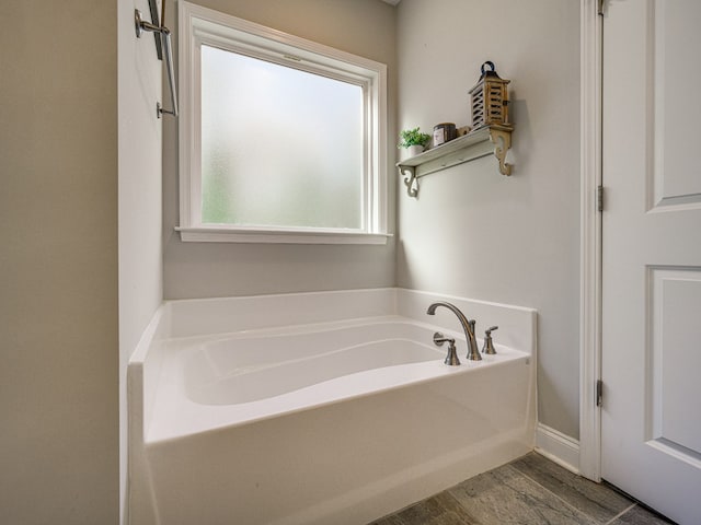 13733 Macon Rd, Upatoi, GA 31829 - bathroom featuring a bath and wood finished floors