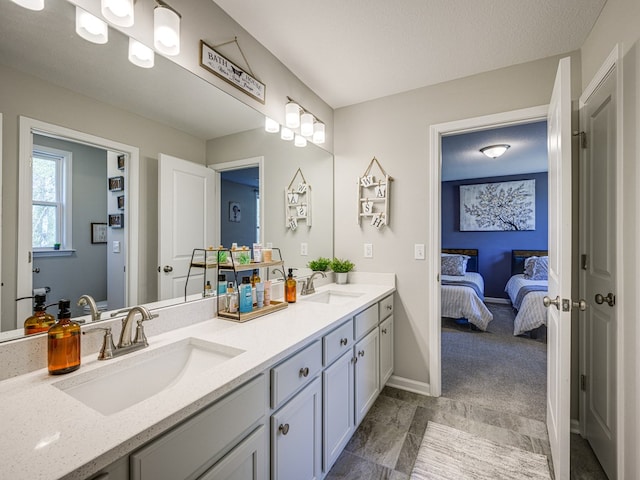 13733 Macon Rd, Upatoi, GA 31829 - ensuite bathroom featuring double vanity and baseboards