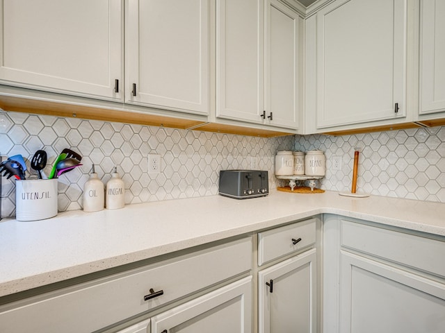 13733 Macon Rd, Upatoi, GA 31829 - kitchen with decorative backsplash and light stone counters