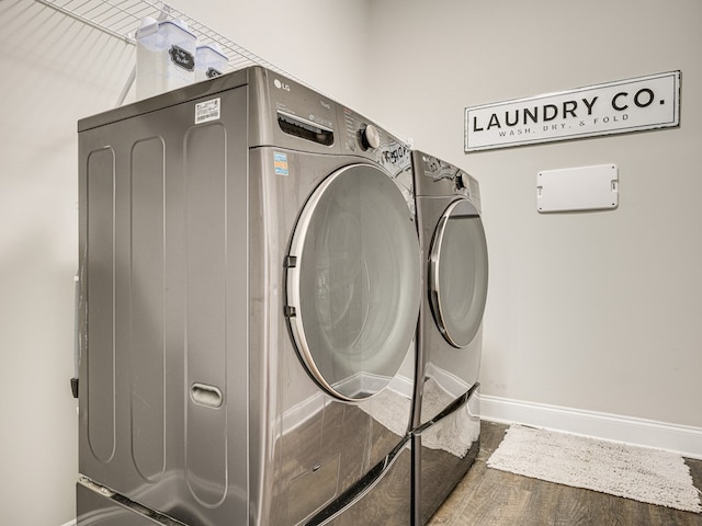13733 Macon Rd, Upatoi, GA 31829 - laundry room with independent washer and dryer and wood finished floors