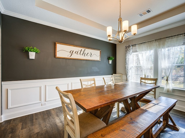13733 Macon Rd, Upatoi, GA 31829 - dining area with dark wood-type flooring, a chandelier, ornamental molding, wainscoting, and a decorative wall