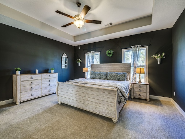 13733 Macon Rd, Upatoi, GA 31829 - bedroom featuring carpet floors, a raised ceiling, and a ceiling fan
