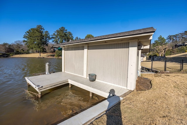 view of dock featuring a water view and fence