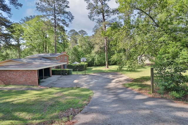 2951 Florence Dr, Columbus, GA 31907 - view of home's community featuring driveway, a yard, and an attached carport