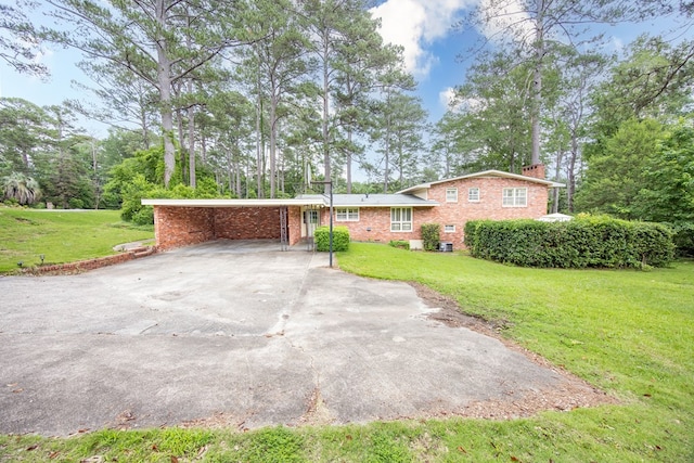 2951 Florence Dr, Columbus, GA 31907 - view of front of property with driveway, brick siding, a front lawn, and a chimney