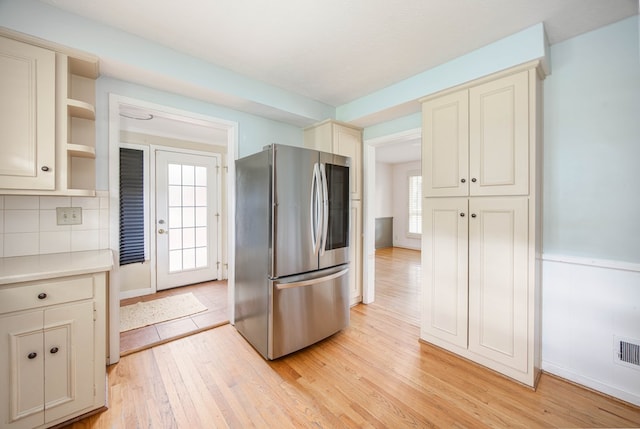 2951 Florence Dr, Columbus, GA 31907 - kitchen featuring freestanding refrigerator, cream cabinets, open shelves, and light wood-style floors