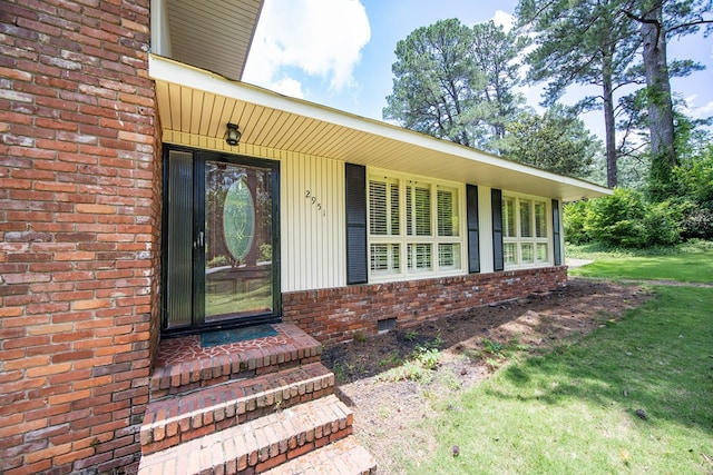 2951 Florence Dr, Columbus, GA 31907 - property entrance with brick siding, covered porch, crawl space, and a yard