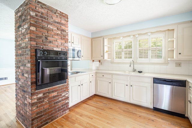 2951 Florence Dr, Columbus, GA 31907 - kitchen with black appliances, open shelves, a textured ceiling, and light wood finished floors