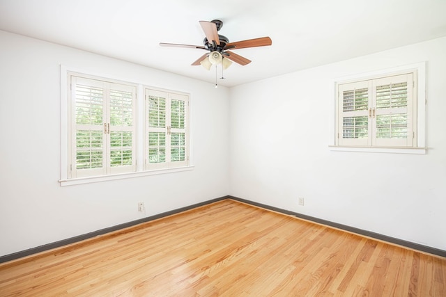 2951 Florence Dr, Columbus, GA 31907 - empty room with plenty of natural light, wood finished floors, baseboards, and a ceiling fan