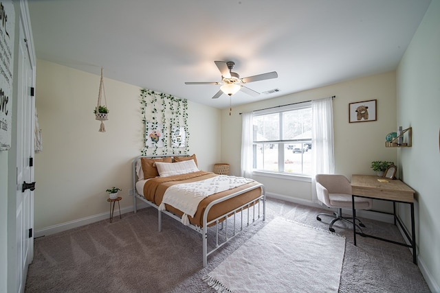 bedroom with ceiling fan and light carpet