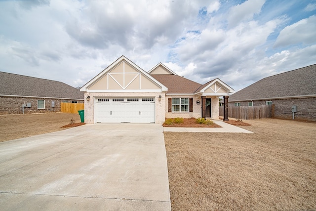 view of front of house with a garage and a front lawn