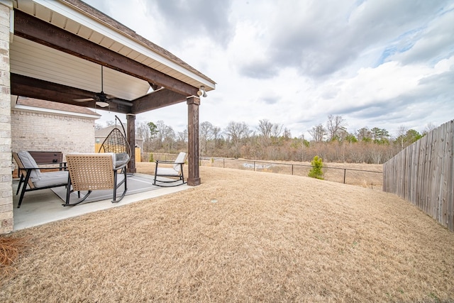 view of yard with a patio and ceiling fan