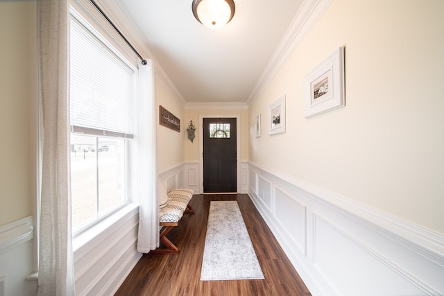 doorway to outside featuring crown molding and dark hardwood / wood-style flooring