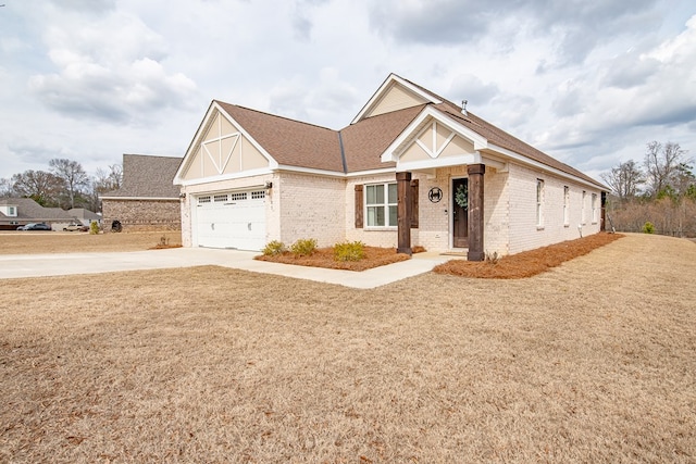 view of front of property with a garage and a front yard