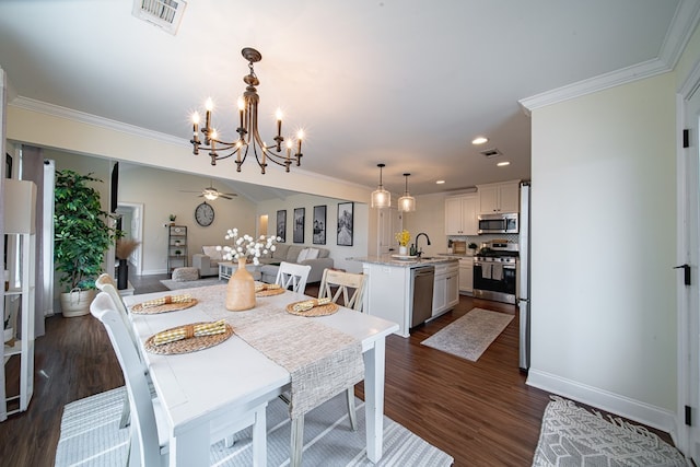 dining area featuring crown molding, dark hardwood / wood-style floors, and ceiling fan with notable chandelier