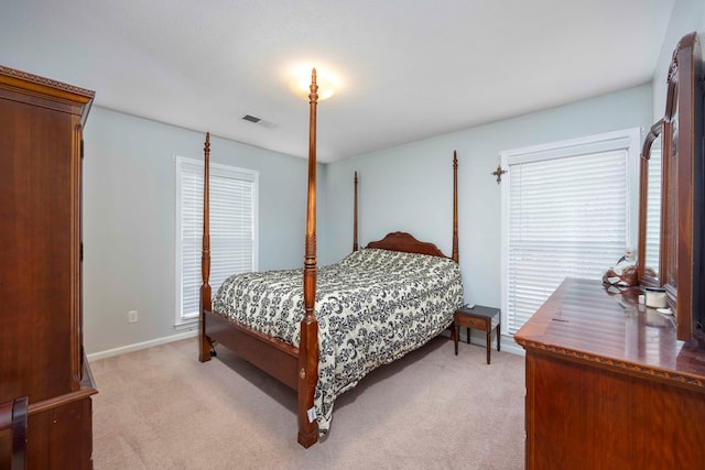 bedroom featuring light colored carpet