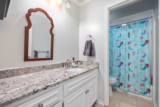 bathroom featuring vanity, tile patterned flooring, toilet, and ornamental molding