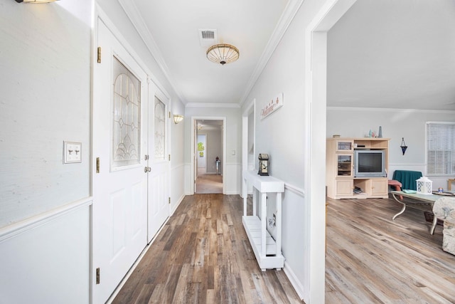 hallway featuring hardwood / wood-style flooring and ornamental molding