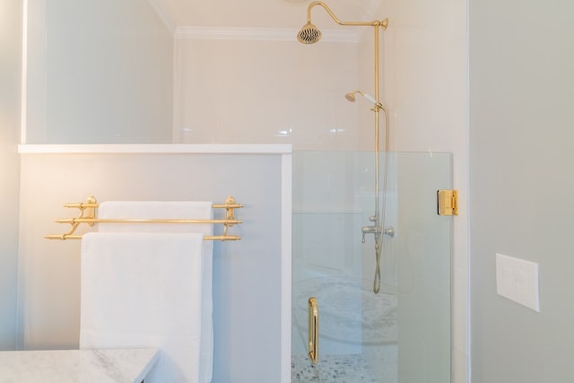 bathroom featuring a stall shower and crown molding