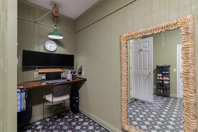 home office featuring tile patterned floors and baseboards