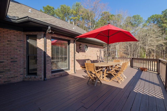 deck with outdoor dining space