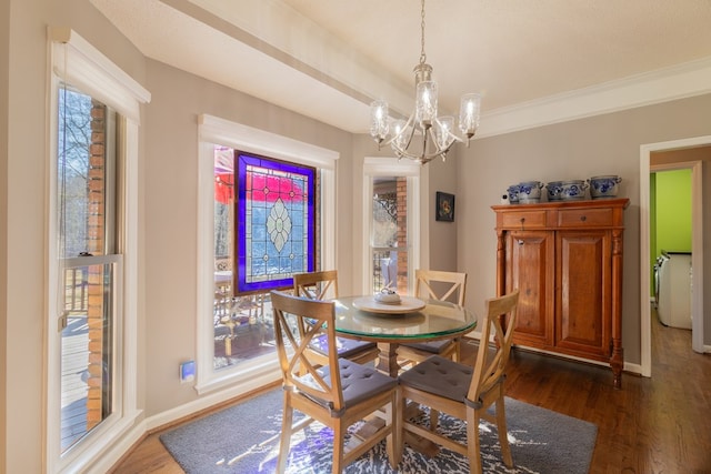 dining room with baseboards, dark wood-type flooring, a chandelier, and crown molding